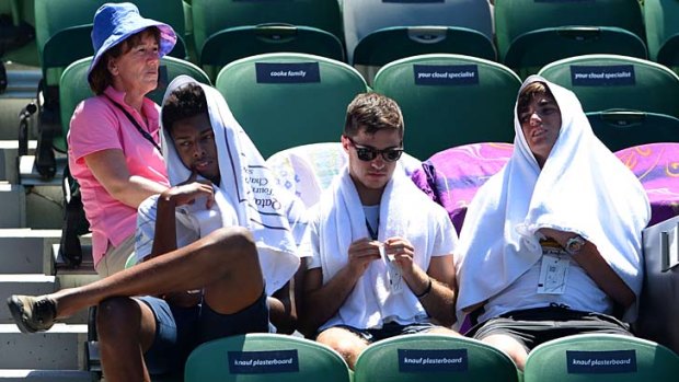 Spectators at the Australian Open have resorted to all sorts of tactics to shelter from the brutal heat.