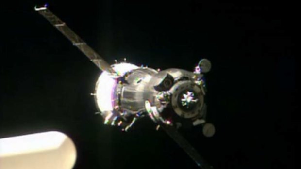 In this image taken from video provided by NASA, the Soyuz TMA-09M carrying three new Expedition 36 crew members approaches the International Space Station on Wednesday.