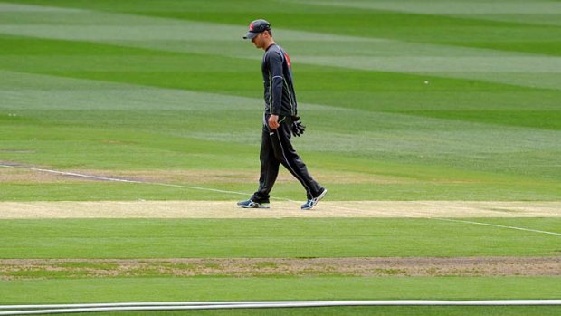Holiday mood ... Michael Clarke inspects the pitch ahead of the Boxing Day Test.