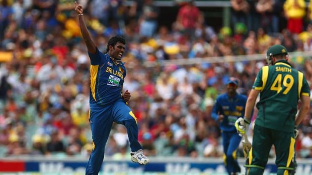 Thisara Perera of Sri Lanka celebrates taking the wicket of Steven Smith during the One Day International in Adelaide.