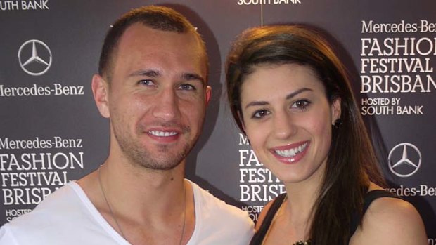 Quade Cooper and Stephanie Rice attend the swim and resort wear group show at the Brisbane Fashion Festival.