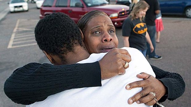 Tragedy ... Shamecca Davis hugs her son Isaiah Bow, who was a witness to the shooting.