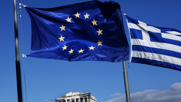 Athens under two flags, Greece's and the EU's.
