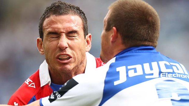 Knight on the charge ... Darius Boyd clashes with Josh Morris of the Bulldogs.