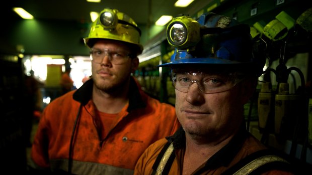 Adam Powell and Darrin Francis in the Springvale mine lamp room after their shift.