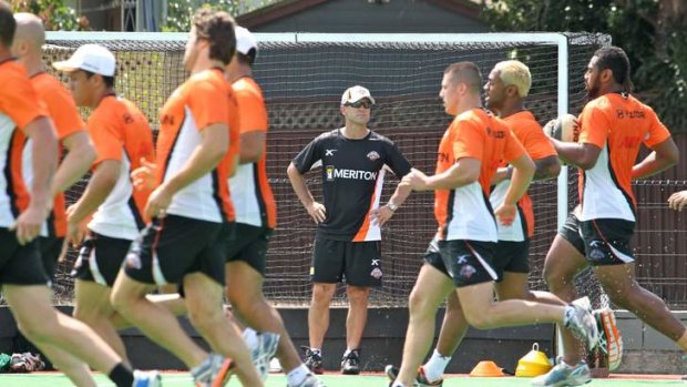 Best to come: under-pressure coach Mick Potter puts his Wests Tigers players through their paces at training.