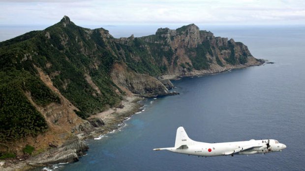 Disputed territory: Japan Maritime Self-Defence Force's P-3C Orion surveillance plane flies over the disputed islands, called the Senkaku in Japan and Diaoyu in China, in 2011.