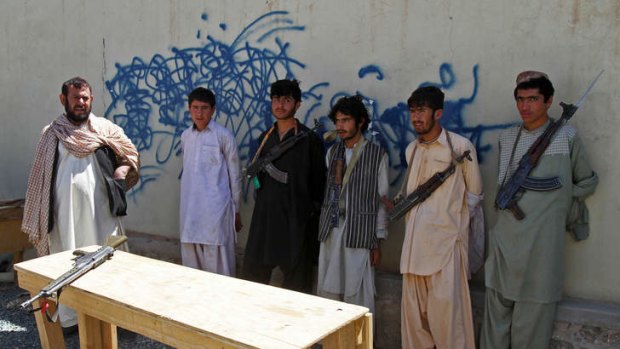 Arrested Taliban fighters are displayed to the media in Panjwai district of Kandahar province in southern Afghanistan on May 28, 2013. Suspected Taliban militants killed seven police in southern Afghanistan after persuading the officers to invite them into their checkpoint for dinner, officials said on Tuesday.