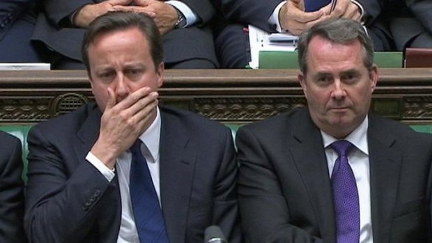 Britain's Prime Minister David Cameron and Defence Minister Liam Fox.