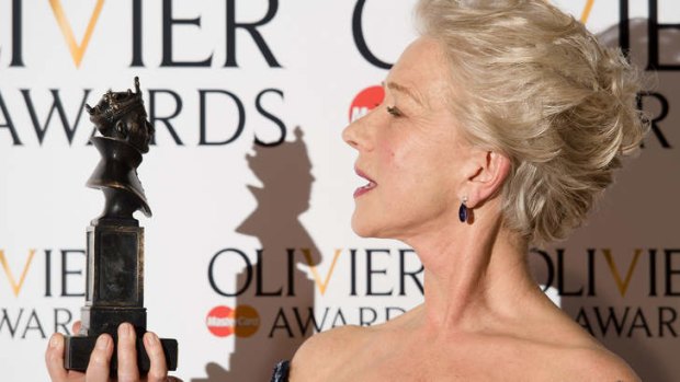 British actress Helen Mirren poses with her award for best actress during the Lawrence Olivier Awards for theatre at the Royal Opera House in London.