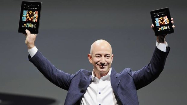Launch ... Amazon CEO Jeff Bezos holds up the new Kindle Fire HD 7" and Kindle Fire HD 8.9".