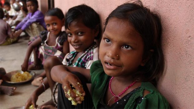 Puja and her classmates at Chatkari village in Bihar, in eastern India, eat their government-sponsored Midday Meal. The program feeds more than 120 million children every day.