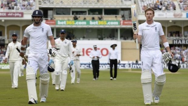 Superb effort: Joe Root acknowledges the crowd as he walks off with his last-wicket comrade James Anderson.