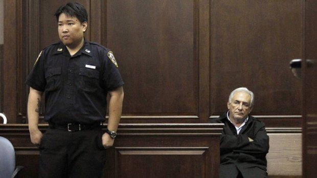 International Monetary Fund (IMF) chief Dominique Strauss-Kahn waits for his arraignment to begin in Manhattan Criminal Court in New York yesterday. Strauss-Kahn has been denied bail on attempted rape and other criminal charges.