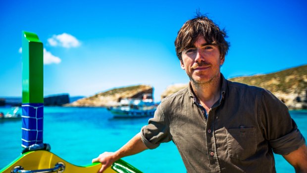 TV presenter Simon Reeve on Malta's Blue Lagoon.