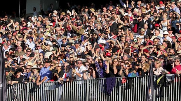 A portion of the huge crowd at Doomben which cheered Black Magic home for her 13th straight win.