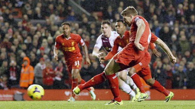 High stakes: Steven Gerrard scores from the penalty spot during Liverpool's 2-2 draw with Aston Villa at Anfield on Saturday.