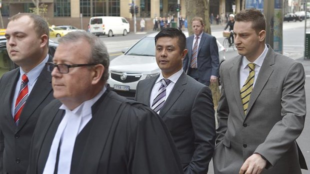Nicholas Levchenko, Quoc Hai Tran and Jacques Fucile arrive at the Supreme Court for sentencing on Wednesday.