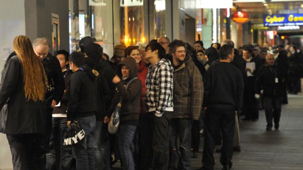 Apple fans queue in Bourke Street for the first iPhone release in 2008.