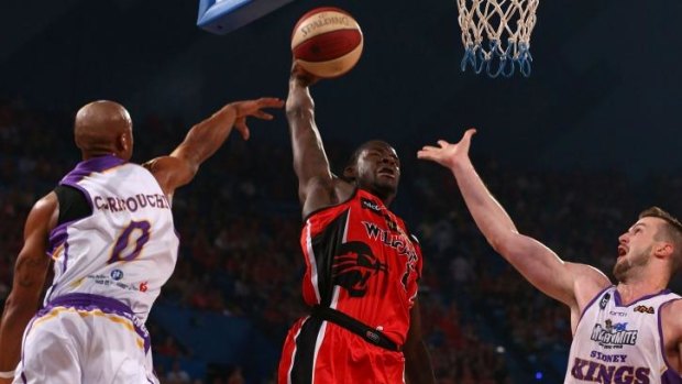 Hang time: James Ennis drives to the hoop for Perth against Sydney last season.