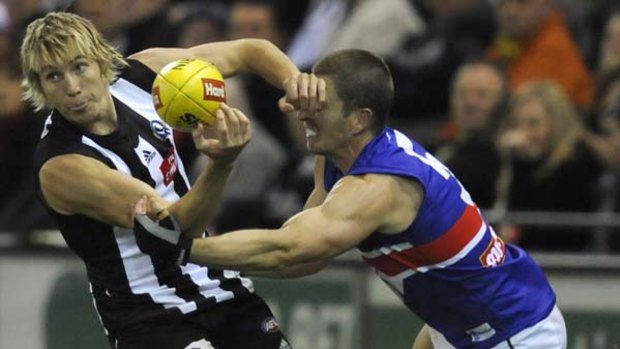 Magpie Dale Thomas and Bulldog Matthew Boyd are lynchpins of their teams' midfields.