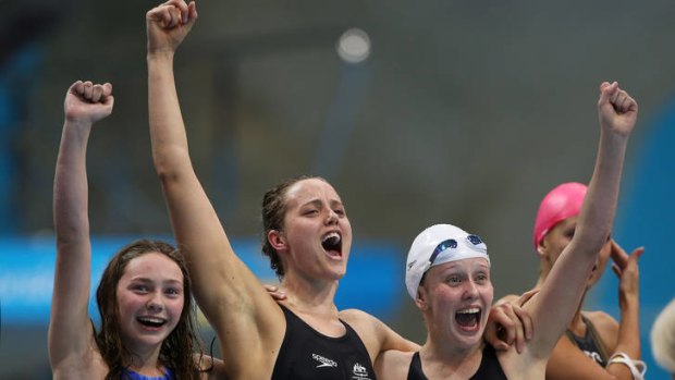 Maddison Elliot (left), Ellie Cole and Katherine Downie celebrate as teamate Jacqueline Freney wins them the gold medal in the women's 4x100m freestyle relay.
