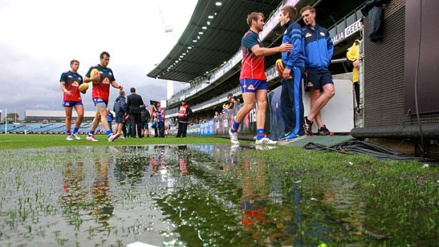 Bulldogs players at a soggy Simonds Stadium on Wednesday.