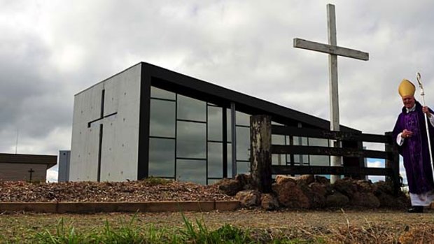 Melbourne Archbishop Denis Hart celebrated Mass with parish priest Grant O'Neill at the rebuilt St Mary's church in Kinglake.