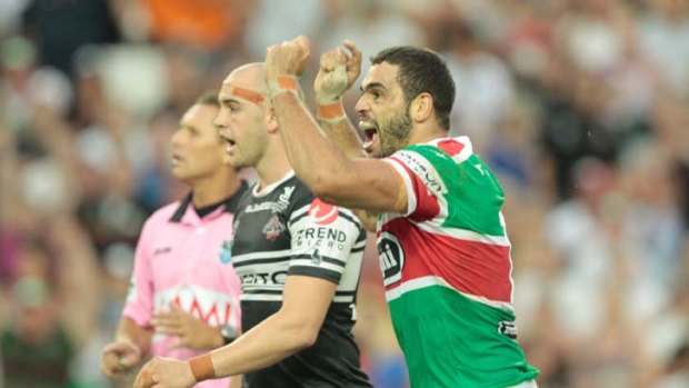 Comeback complete ... Greg Inglis celebrates after booting the match-winner.