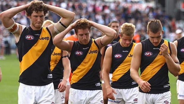 It's dejection for the Tigers after a narrow loss to Geelong in round four.