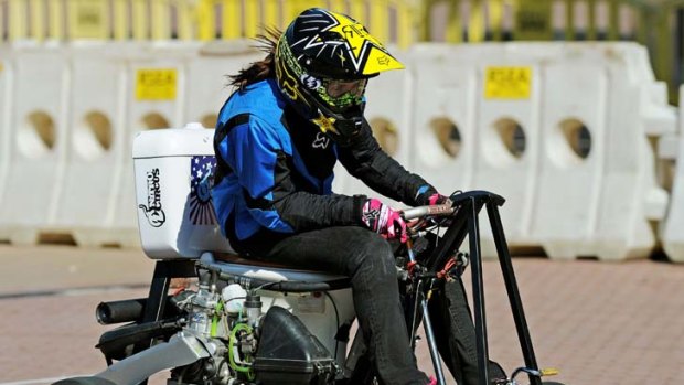 Canadian female action sports star Jolene van Vugt makes a pass on her way to setting a new Guinness World Record for driving a toilet at the greatest speed.