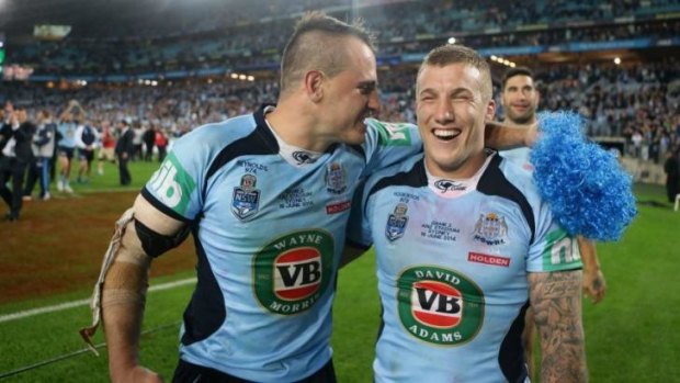 Winners are grinners: Bulldogs halves duo Josh Reynolds and Trent Hodkinson are all smiles after the Blues' 6-4 victory over Queensland.