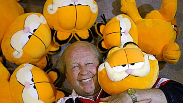 Cat tales ... Jim Davis with the character he created, Garfield.