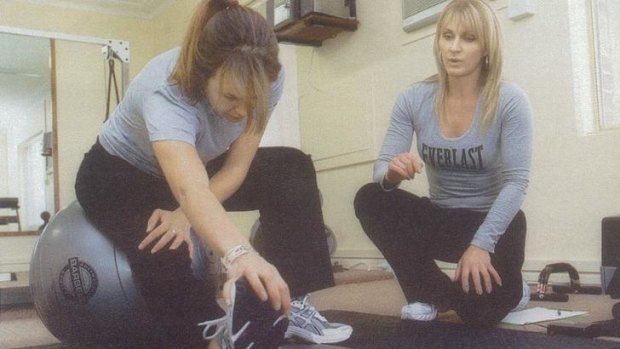 A bit of a stretch: The author is put through her paces by personal trainer Donna Aston.