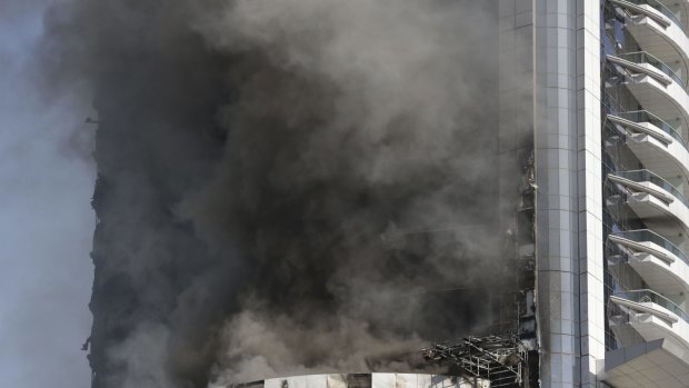 A fire burns in the Address Downtown skyscraper in Dubai, United Arab Emirates on Friday.
