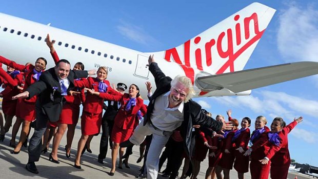 British tycoon Richard Branson (C) and Virgin Australia CEO, John Borghetti (L) at the unveiling of the airline's new brand.