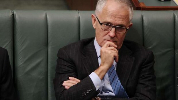 Communications Minister Malcolm Turnbull listens during question time on Thursday.