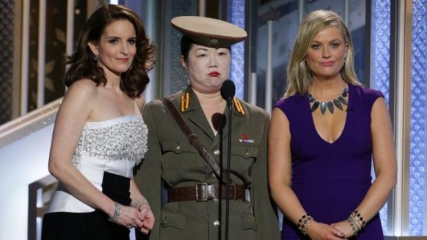 Tiny Fey, from left, Margaret Cho, and Amy Poehler make gags at North Korea's expense at the 72nd Annual Golden Globe Awards.