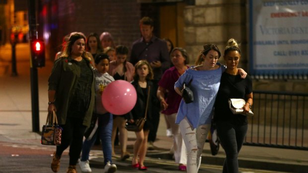 Members of the public are escorted from the Manchester Arena after the suicide bombing attack.