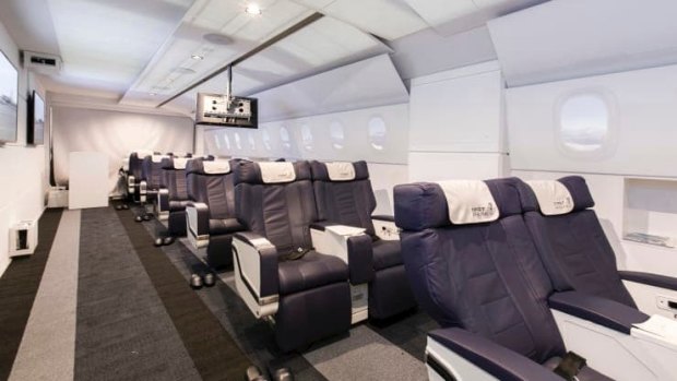 Passengers are seated in Airbus A380 or A340 aircraft seats.