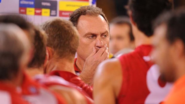 Sydney coach John Longmire considers his options at quarter-time.