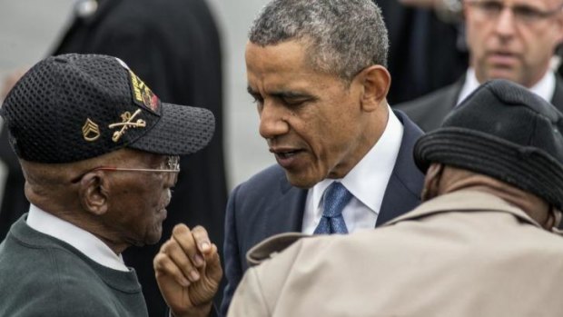 President Barack Obama talks with World War II veterans in New York.