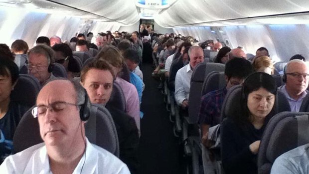 Standing room only... The first Qantas Flight back to the Gold Coast was sold-out.
