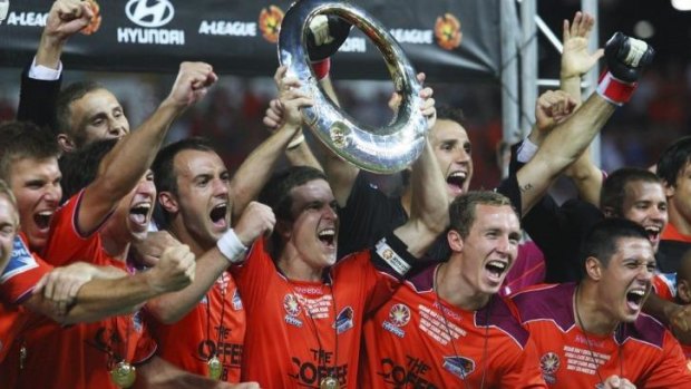 Roaring: Brisbane Roar players celebrate their come-from-way-behind A-League grand final victory over the Central Coast Mariners in 2011.