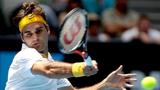 Roger Federer hits a forehand during his quarter final against Stanislas Wawrinka.