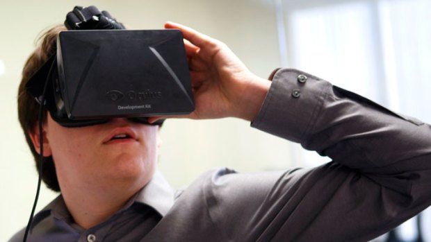 A vision splendid: Palmer Lucky, the creator of the Oculus Rift headset that immerses the wearer in a virtual reality video game, demonstrates the device.