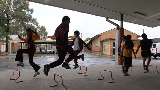 Stepping it up ...  students at Lansvale Public School  exercise in a covered area. Lansvale uses time within school hours to meet  the exercise target outlined by the Department of Education.