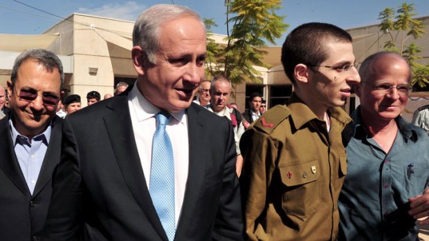 On Israeli soil .... Gilad Shalit with Israeli Prime Minister Benjamin Netanyahu, left.
