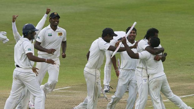 Sri Lankan players celebrate their first Test victory in South Africa.