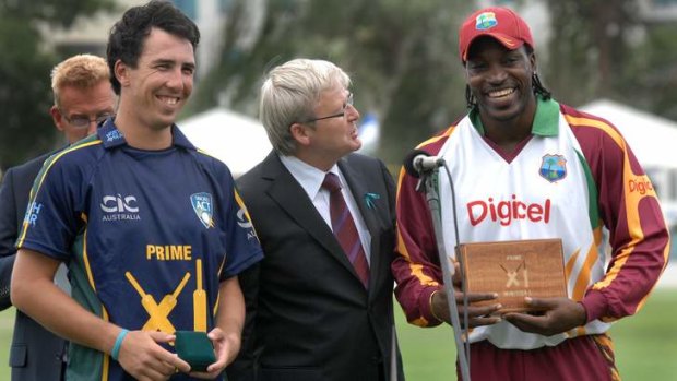 Joint Man of the Match award winners, Tom Cooper, left and Chris Gayle with PM Kevin Rudd in 2010.